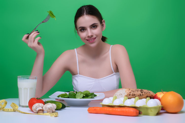 Woman eating vegetables